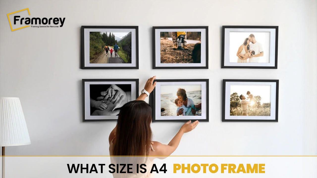 what size is A4 photo frame  text and a lady hangs a photo frame on a wall.