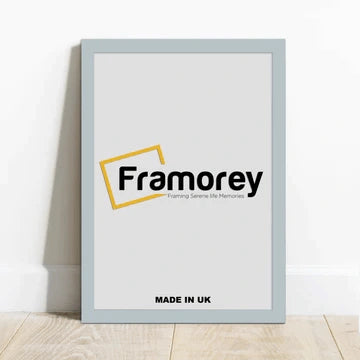 Light Grey picture frame with a Framorey logo is standing with the wall on a wooden surface.