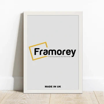 Rectangle white picture frame With a Framorey logo Leaning with the wall on a wooden surface